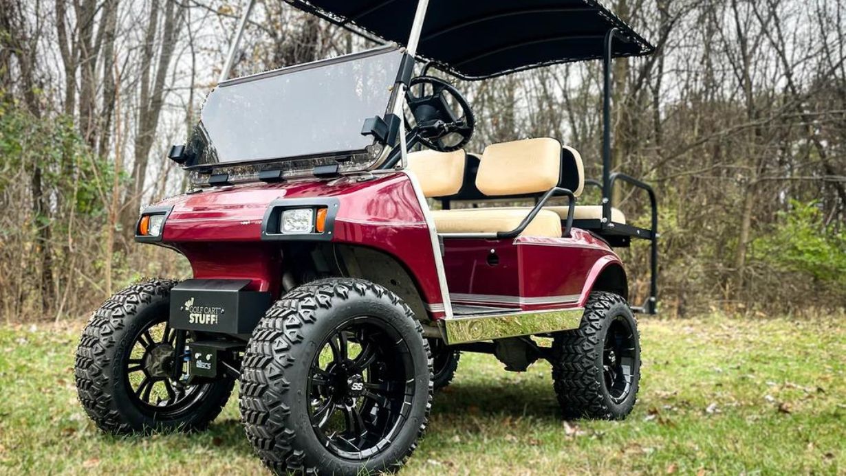 Golf cart with a lift kit and 23" all-terrain golf cart tires