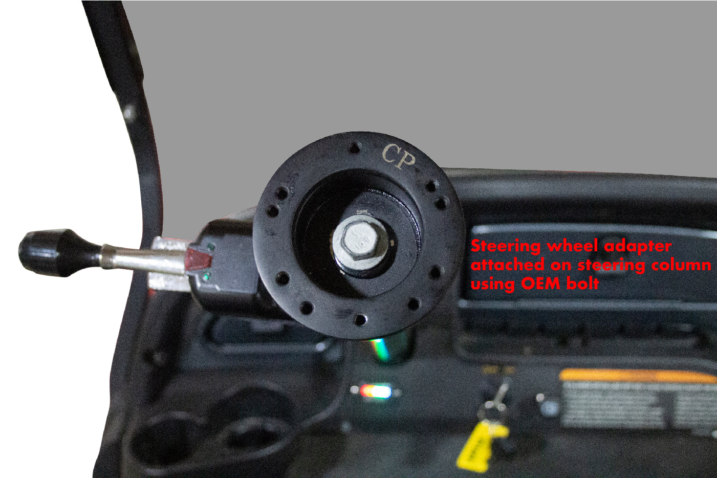 Golf cart steering wheel adapter installed on steering column
