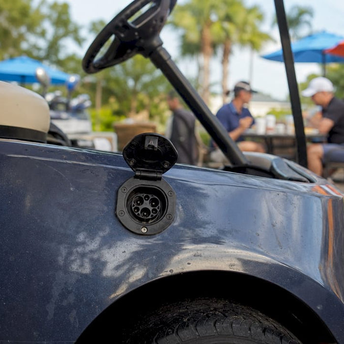 Golf cart charger port on driver-side panel