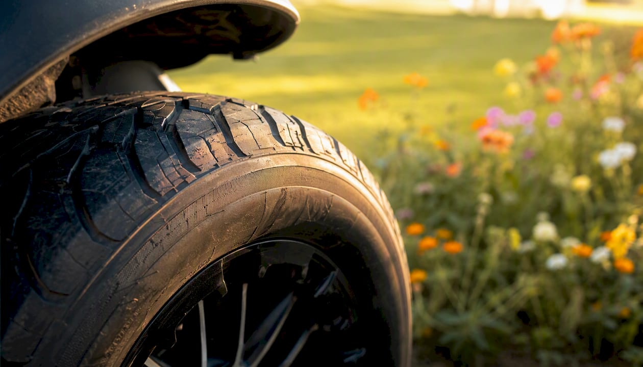 Close-up of golf cart tire sidewall outdoors