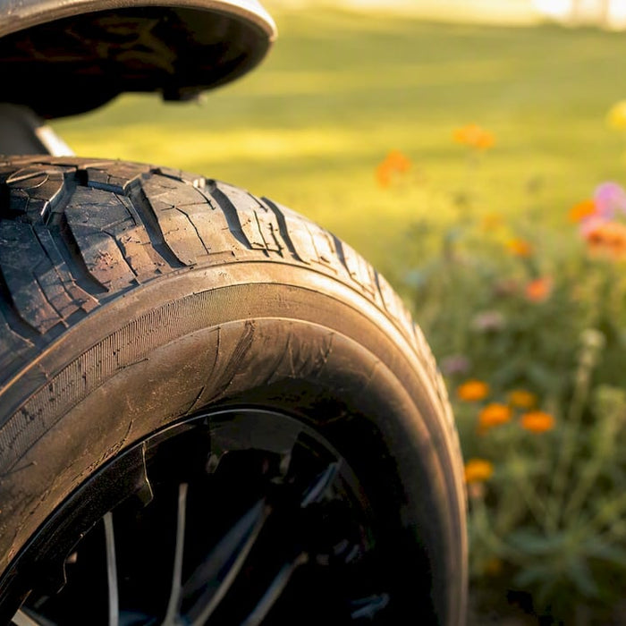 Close-up of golf cart tire sidewall outdoors