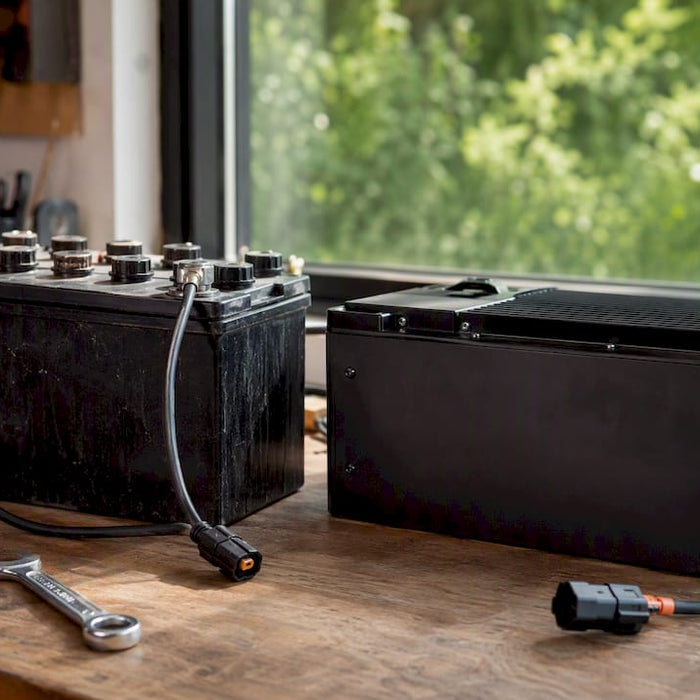 Close-up of lead-acid and lithium golf cart batteries