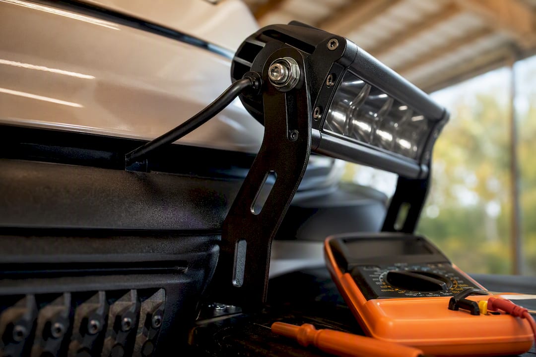 Slotted bracket mounting a golf cart light bar