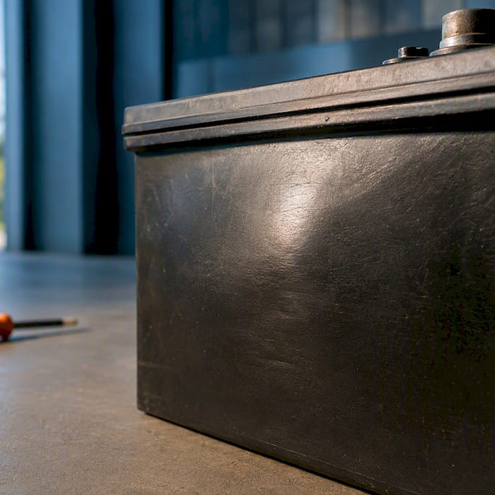 Bulging golf cart battery case close-up